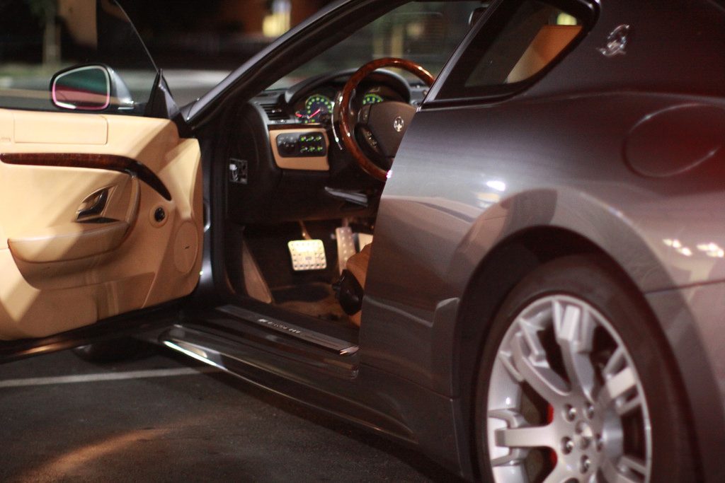 Photo of a sleek grey Maserati auto, illustrating the luxurious life available to the top 1%.