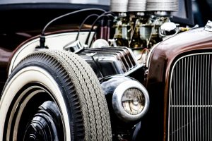 A 1930's-era classic car, illustrating the way to beat Murphy's Law is by modeling an emergency fund after the fender-mounted spare tire.