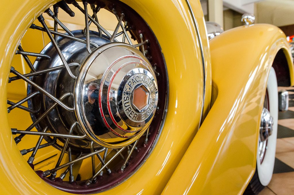 A close-up of a fender-mounted spare tire on a classic Packard Super Eight illustrating the that your emergency fund needs to be easily accessible.