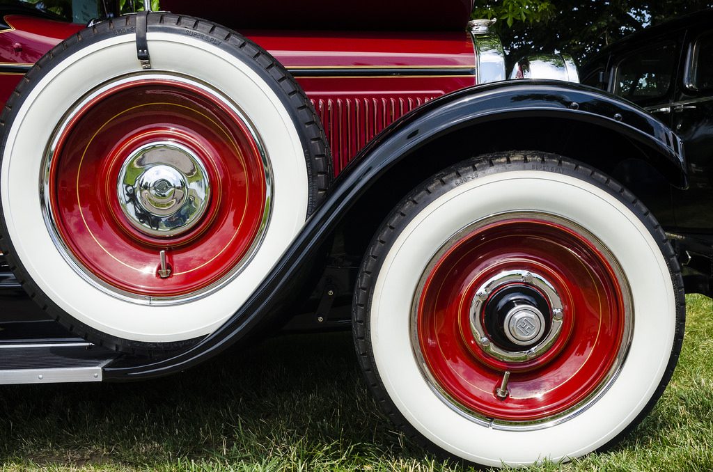 A close-up of a fender-mounted spare tire on a classic Hupmobile, illustrating the similarities between a spare tire and an emergency fund.