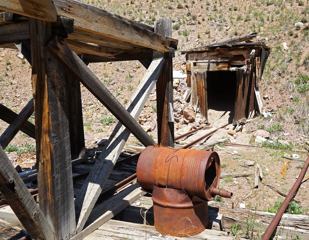 The entrance to a gold mine shaft, illustrating how mining your debt with extra payments can lead to both income and wealth.