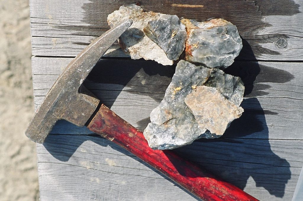 Chunks of quartz containing visible gold flakes, illustrating the wealth of potential riches contained within your debt.