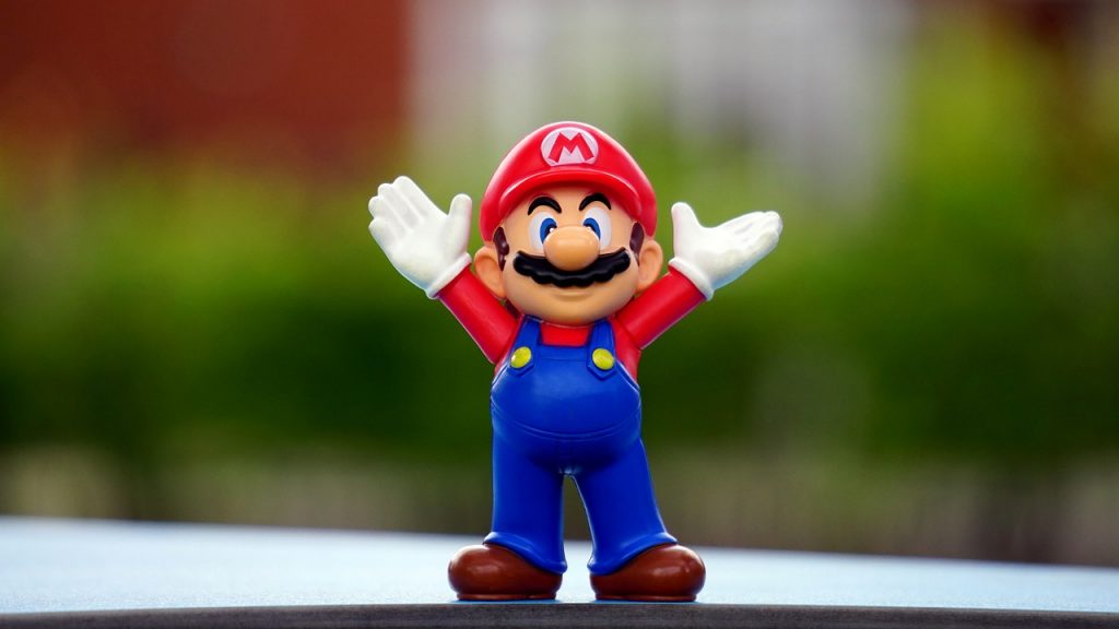 Super Mario character with arms raised in triumph.