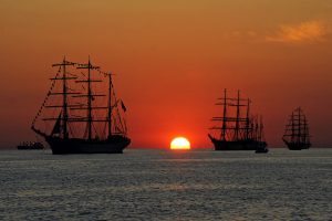 A fleet of warships from the Age of Sail, illustrating how the use of naval tactics can help combat overspending.