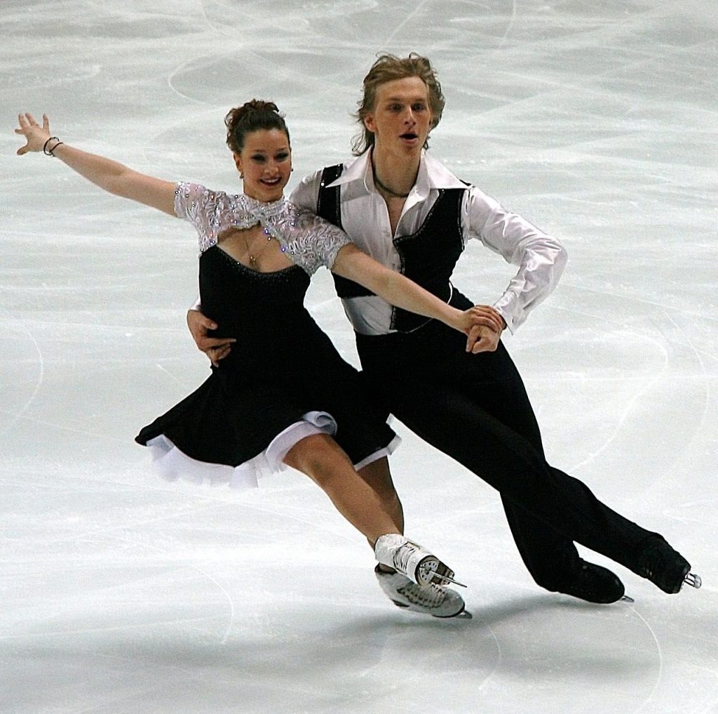 An olympic couple figure skating, illustrating the need for choreography in the cash flow of every monthly budget.
