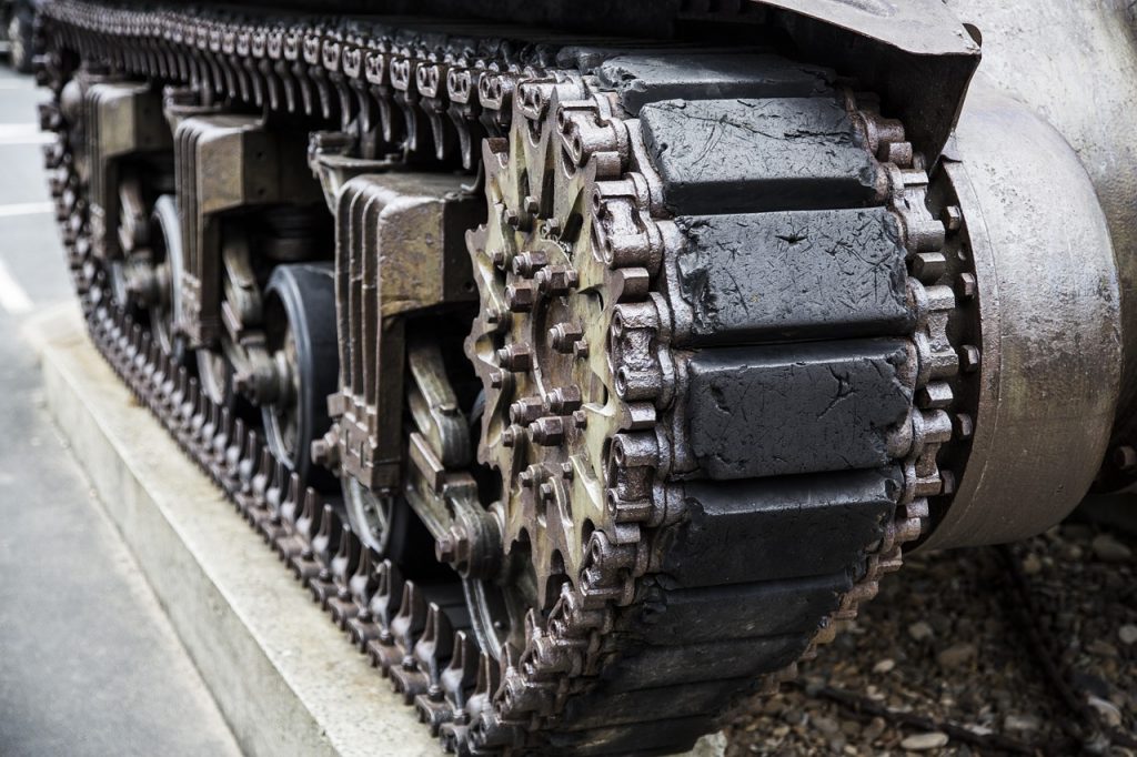 Close-up of the track on an army tank, symbolizing the benefits of creating a heavily-armored budget.