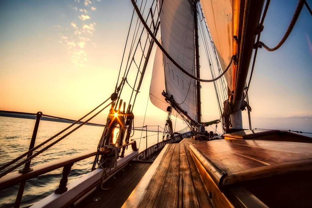 Wooden planks on a sailboat deck, illustrating the eight planks required to build a leak-proof bill pay system.