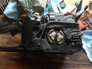 My chainsaw on the workbench, disassembled for repair.