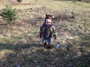 Our son pictured excitedly tramping about the Christmas Tree Farm.